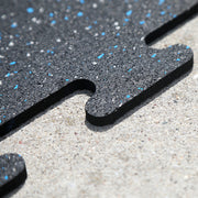 Close up of the interlocking tabs on the rubber gym tiles.