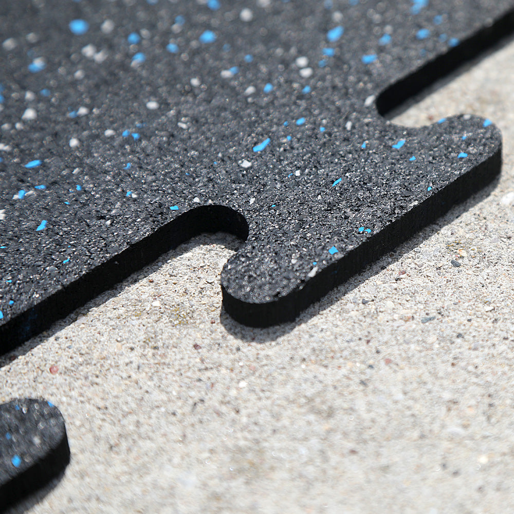 Close up of the interlocking tabs on the rubber gym tiles.