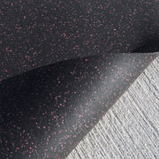 Eco-friendly recycled rubber gym mat for functional training on a gray background.