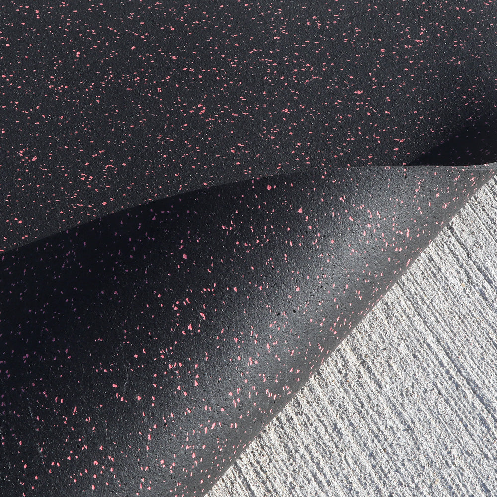 Eco-friendly recycled rubber gym mat for functional training on a gray background.