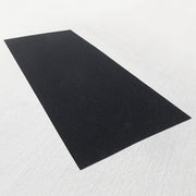 Slip-resistant rubber gym flooring mat for home gym on a gray background.