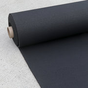 Black rubber roll gym flooring rolled out on the concreate.