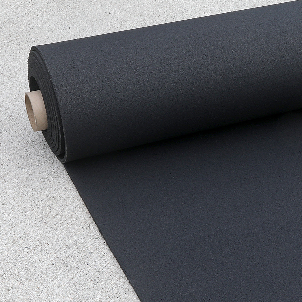 Black rubber roll gym flooring rolled out on the concreate.
