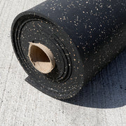 Eggshell/Cocoa fleck 8mm Rubber Roll laying on concrete.