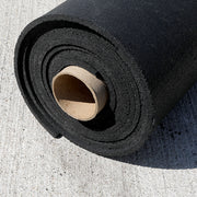 Black rubber gym roll laying on the concreate.