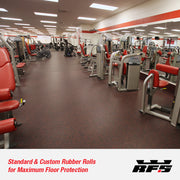 Large commercial gym interior with red and gray equipment and the floor is covered with rubber gym rolls.