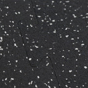 Close up of two rubber gym tiles interlocking together.