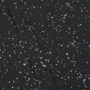 Close up of the interlocking on a gray fleck rubber gym tile.
