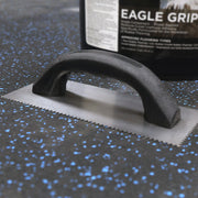V-Notch Trowel sitting on a rubber floor.