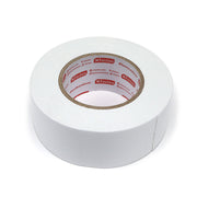 Roll of double sided tape laying on its side. 