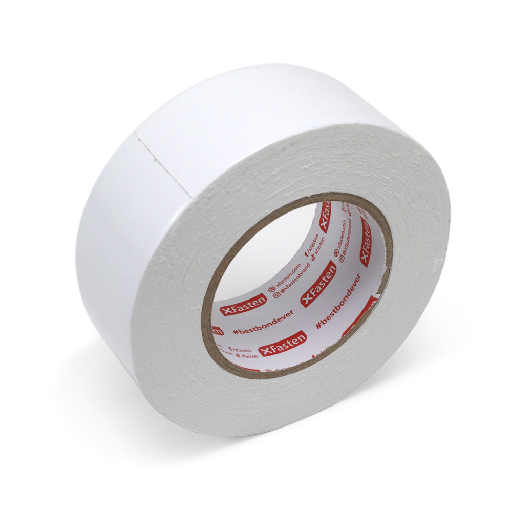 Roll of double side tape standing up on its edge. 