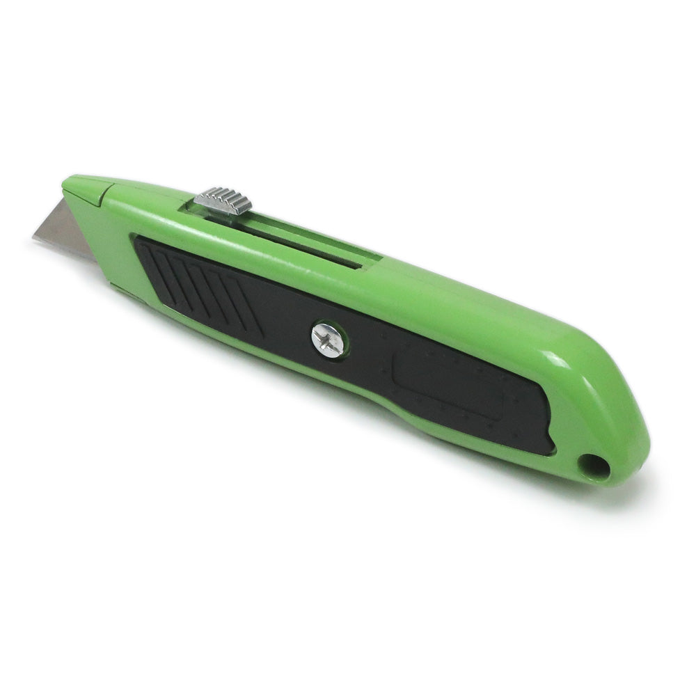 Green utility knife standing on its edge on a white background.